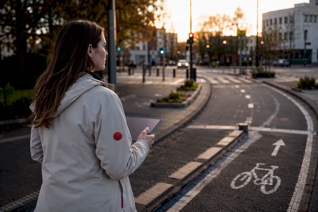 Planner surveying a protected urban cycle route